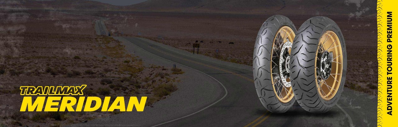 Dunlop Trailmax Meridian packshot and logo on desert road