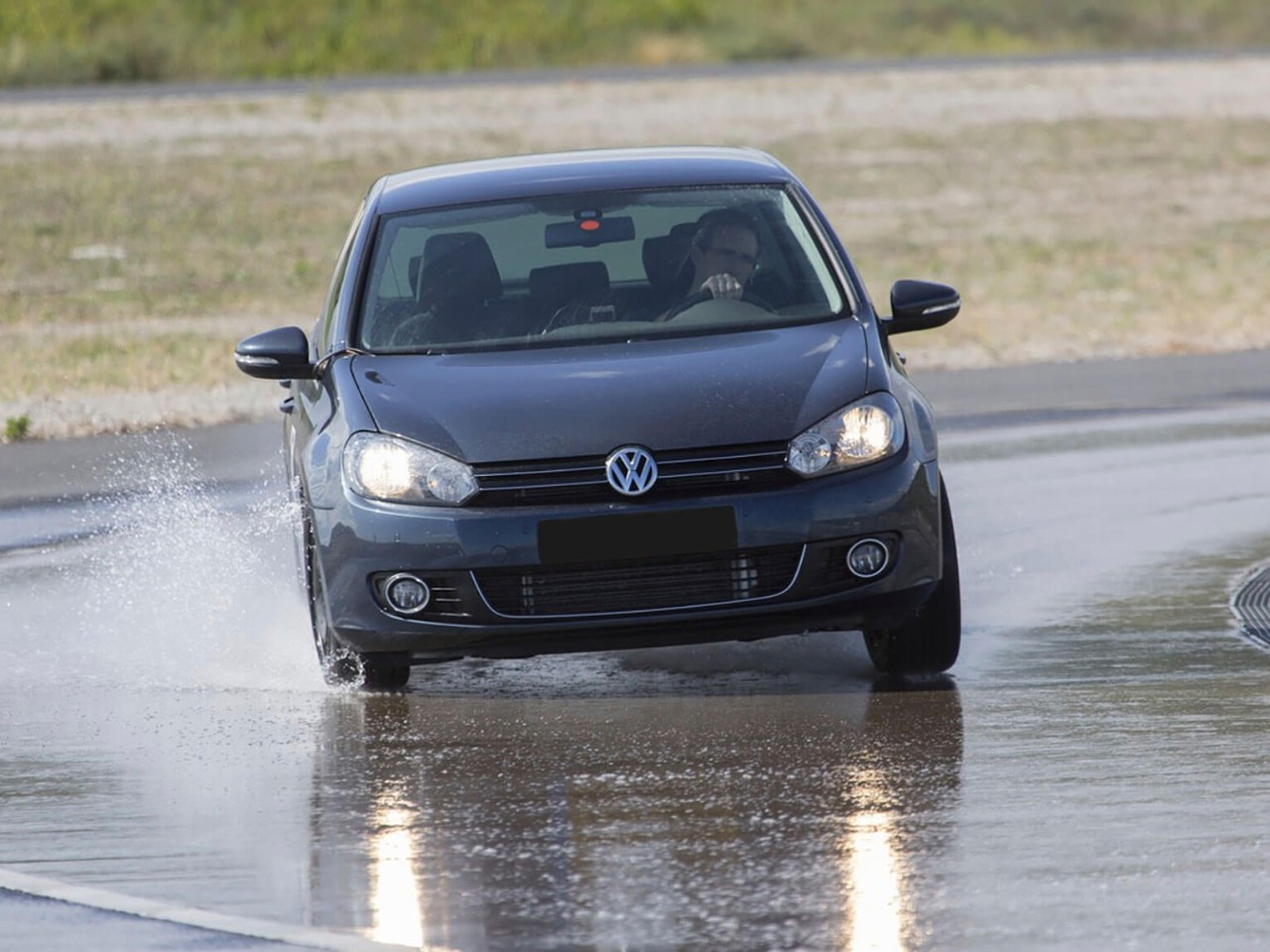 VW car, Dunlop Tyres on wet track