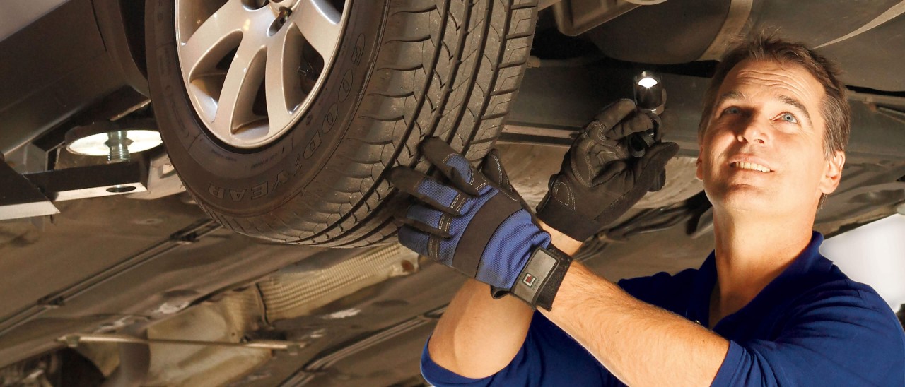 Dealer checking tyres