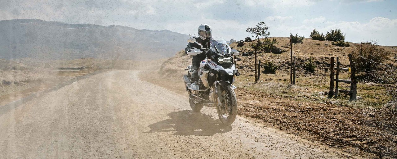BMW GS riders on Dunlop Trailmax Meridian tyres on dusty track